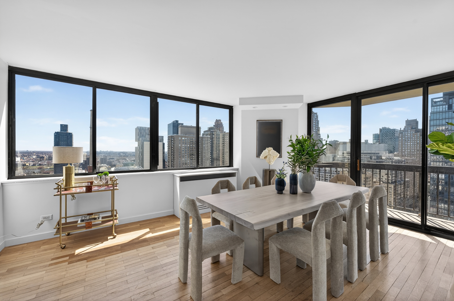 330 East 75th Street, Unit 28BC Manhattan, NY 10021 - Photo 3 of 17 a view of a dining room with furniture window and wooden floor