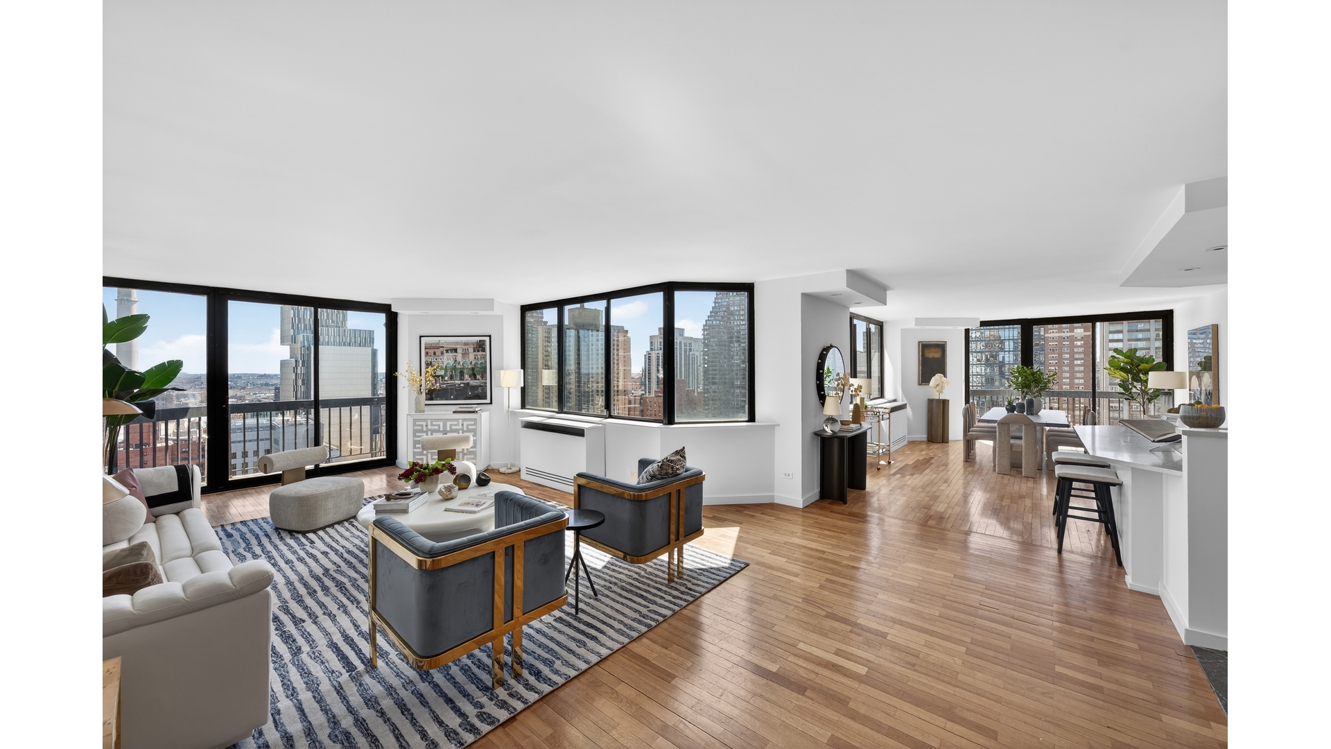 330 East 75th Street, Unit 28BC Manhattan, NY 10021 - Photo 4 of 17 a living room with furniture and a large window