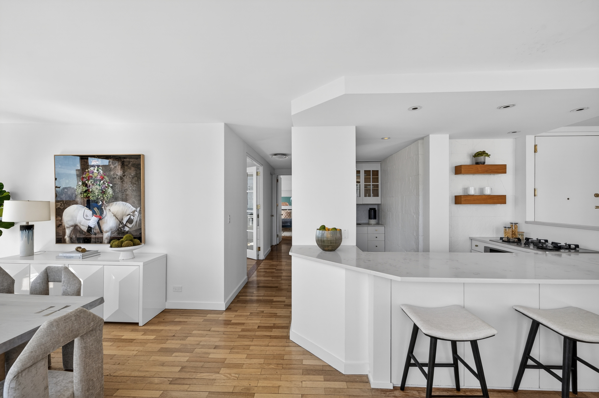 330 East 75th Street, Unit 28BC Manhattan, NY 10021 - Photo 6 of 17 a dining room with furniture and wooden floor