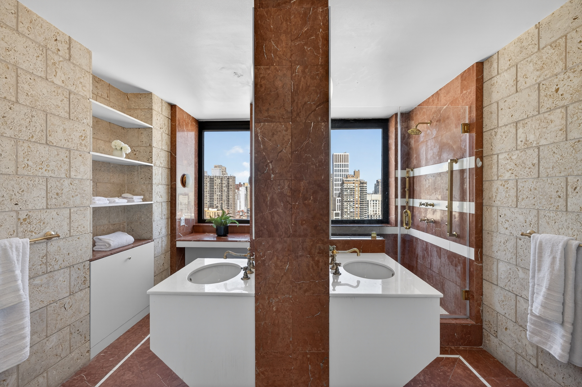 330 East 75th Street, Unit 28BC Manhattan, NY 10021 - Photo 8 of 17 a view of washer and dryer with bathroom in the background