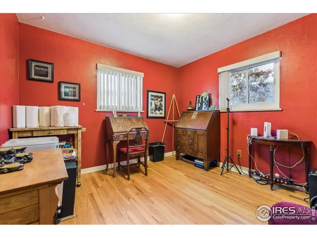 a room with furniture and wooden floor