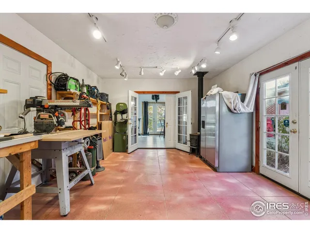 a open kitchen with stainless steel appliances granite countertop a refrigerator and stove