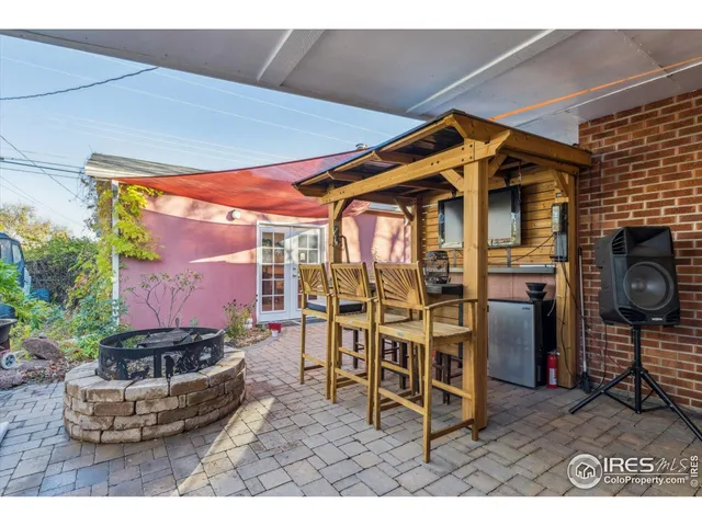 a view of a chairs and table in the patio