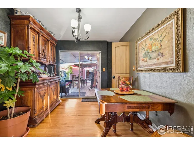 a view of a dining room with furniture and chandelier