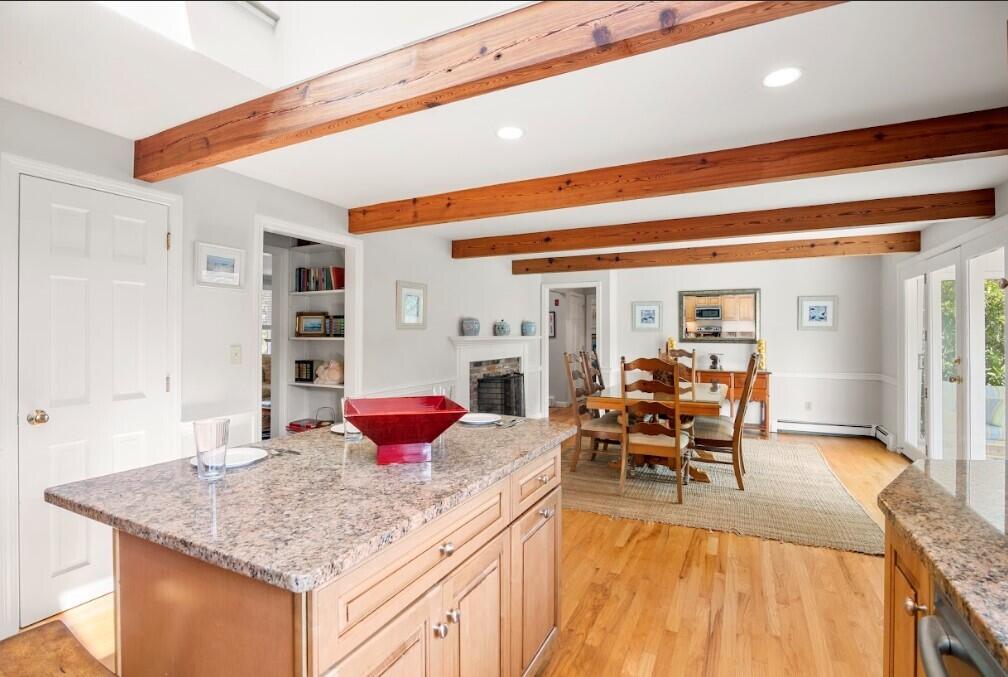 11 Fox Ridge Drive Orleans, MA 02653 - Photo 18 of 57 a kitchen with granite countertop a table and chairs in it