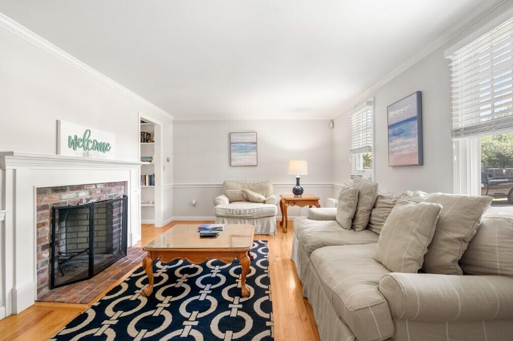 11 Fox Ridge Drive Orleans, MA 02653 - Photo 21 of 57 a living room with furniture and a fireplace