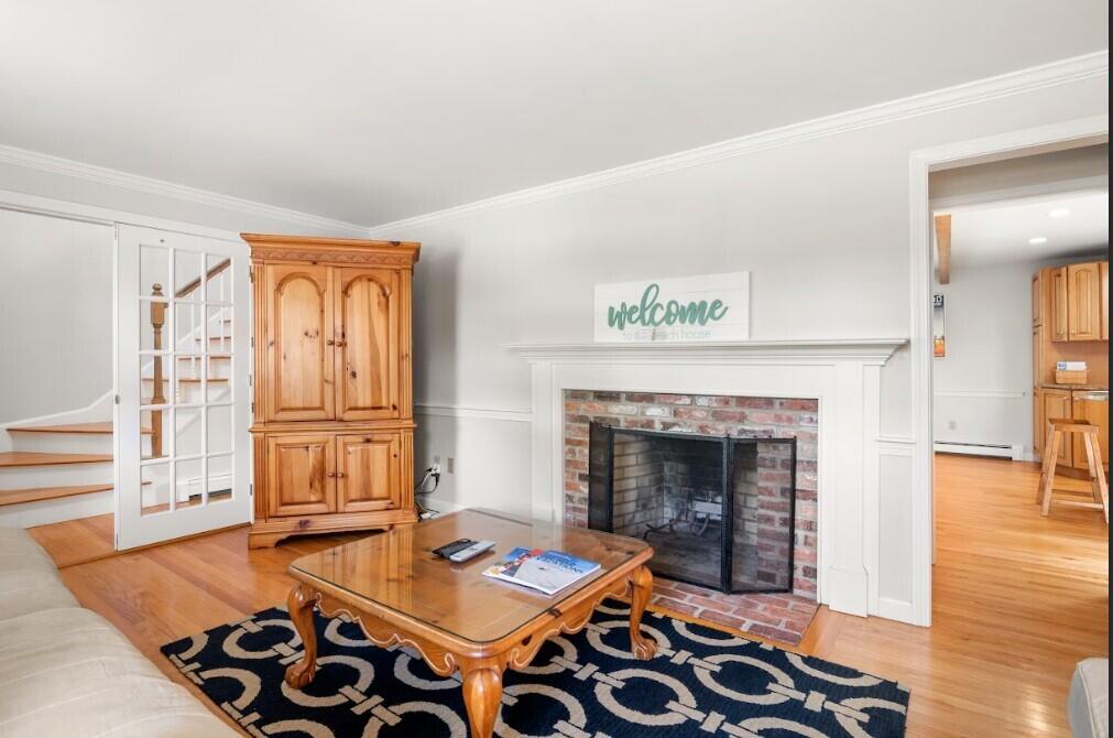 11 Fox Ridge Drive Orleans, MA 02653 - Photo 22 of 57 a living room with furniture and a fireplace
