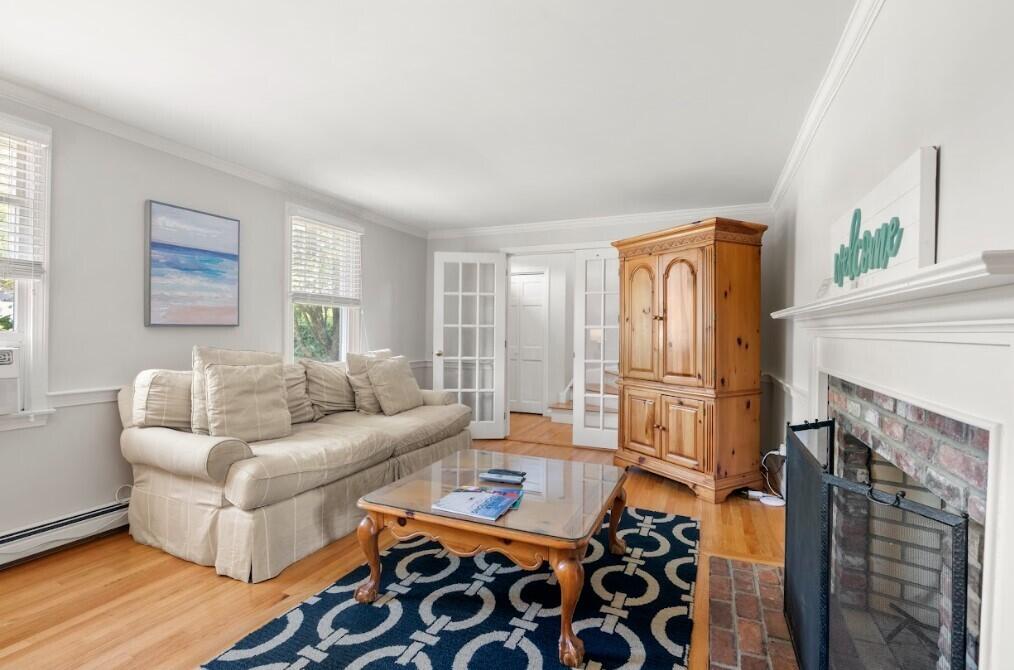 11 Fox Ridge Drive Orleans, MA 02653 - Photo 23 of 57 a living room with furniture and a fireplace