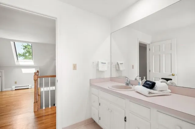 a bathroom with a shower and a window