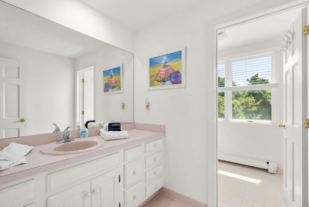 11 Fox Ridge Drive Orleans, MA 02653 - Photo 37 of 57 a bathroom with a double vanity sink and a mirror