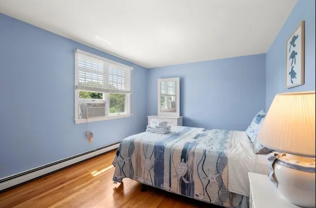 a spacious bedroom with a bed and a couch