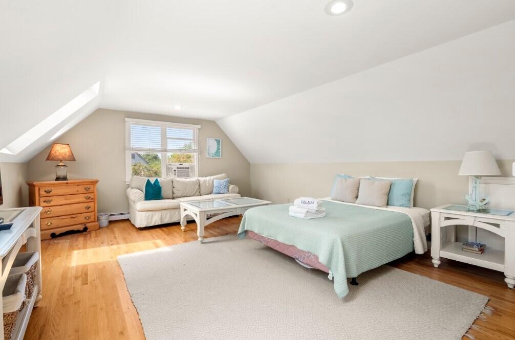 11 Fox Ridge Drive Orleans, MA 02653 - Photo 42 of 57 a spacious bedroom with a bed and a couch