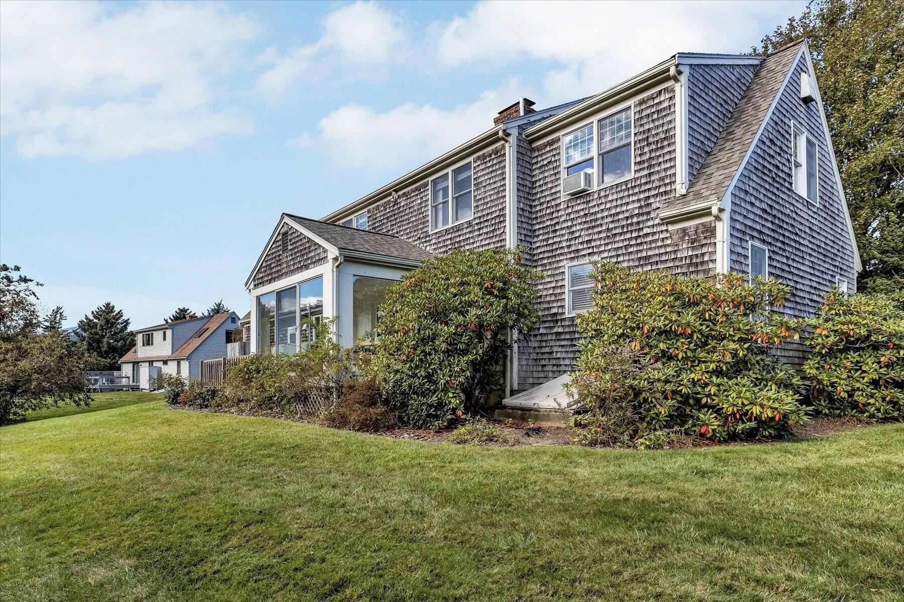 11 Fox Ridge Drive Orleans, MA 02653 - Photo 5 of 57 a front view of a house with garden