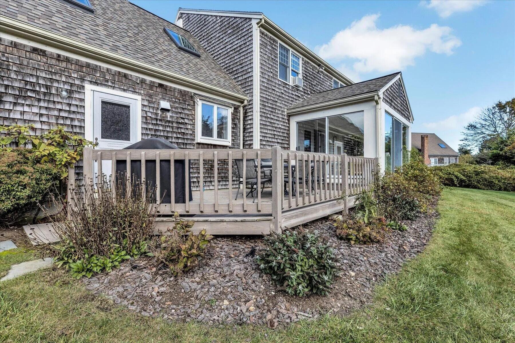 11 Fox Ridge Drive Orleans, MA 02653 - Photo 6 of 57 a front view of a house with yard and porch