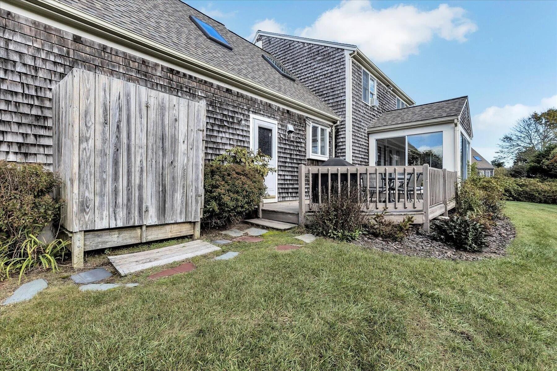 11 Fox Ridge Drive Orleans, MA 02653 - Photo 7 of 57 a front view of a house with garden