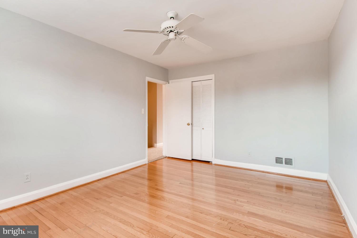 7013 Heathfield Road Baltimore, MD 21212 - Photo 14 of 33 a view of an empty room with wooden floor