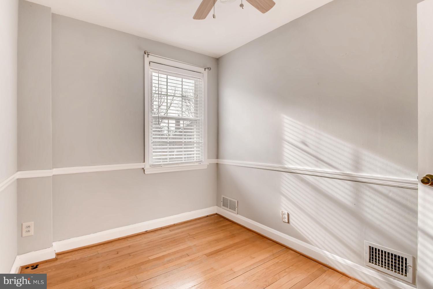7013 Heathfield Road Baltimore, MD 21212 - Photo 17 of 33 a view of a room with a window and wooden floor