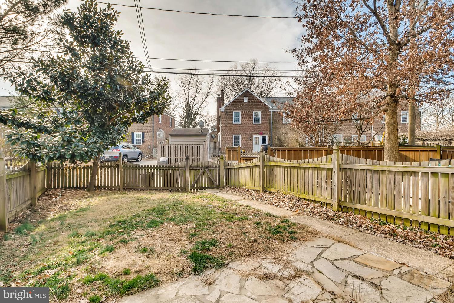 7013 Heathfield Road Baltimore, MD 21212 - Photo 25 of 33 a view of a house with a wooden fence