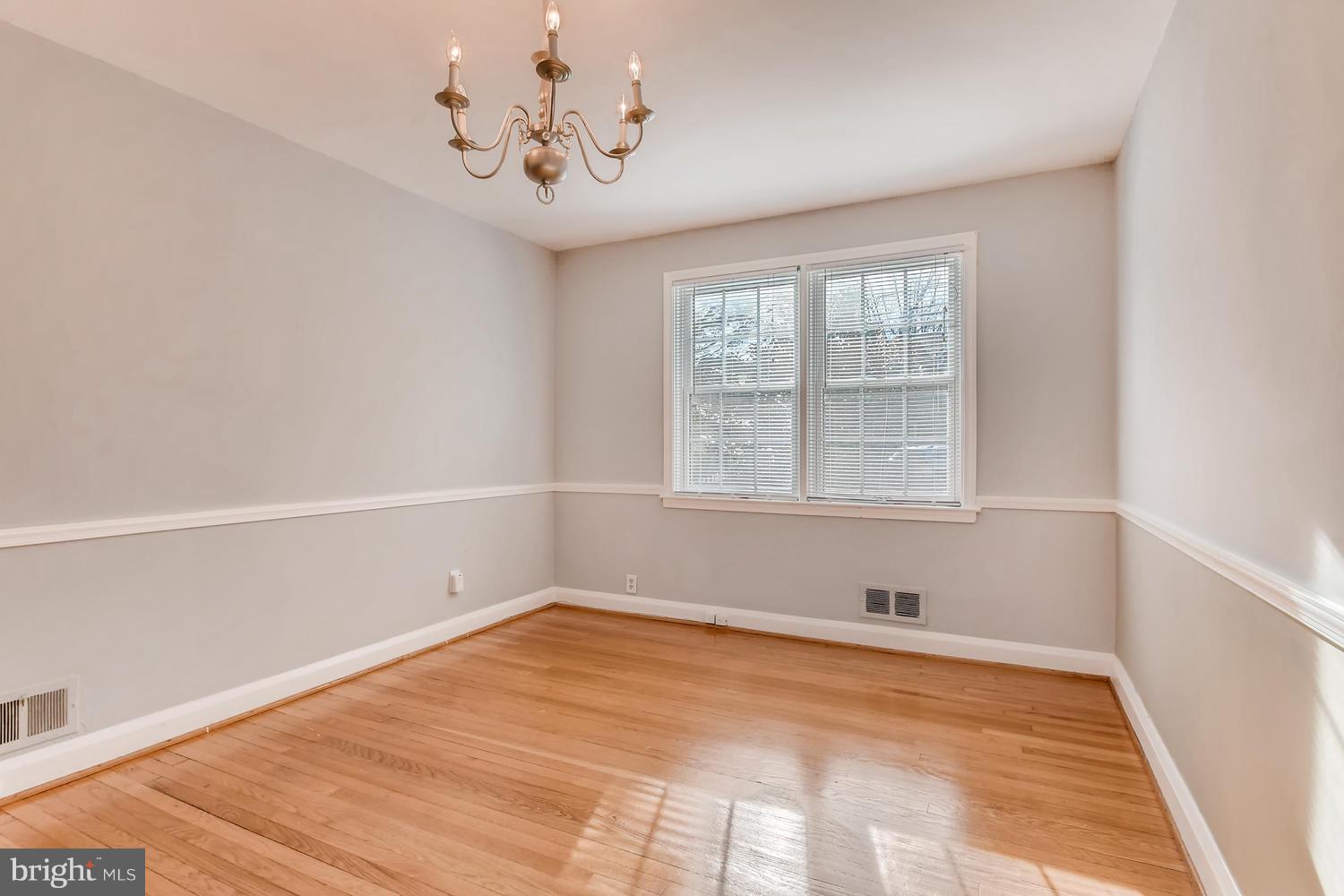 7013 Heathfield Road Baltimore, MD 21212 - Photo 7 of 33 a view of an empty room with a window