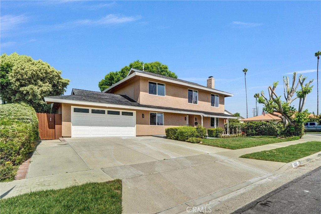 1355 Limerick Drive Placentia, CA 92870 - Photo 1 of 33 a front view of a house with a yard and potted plants