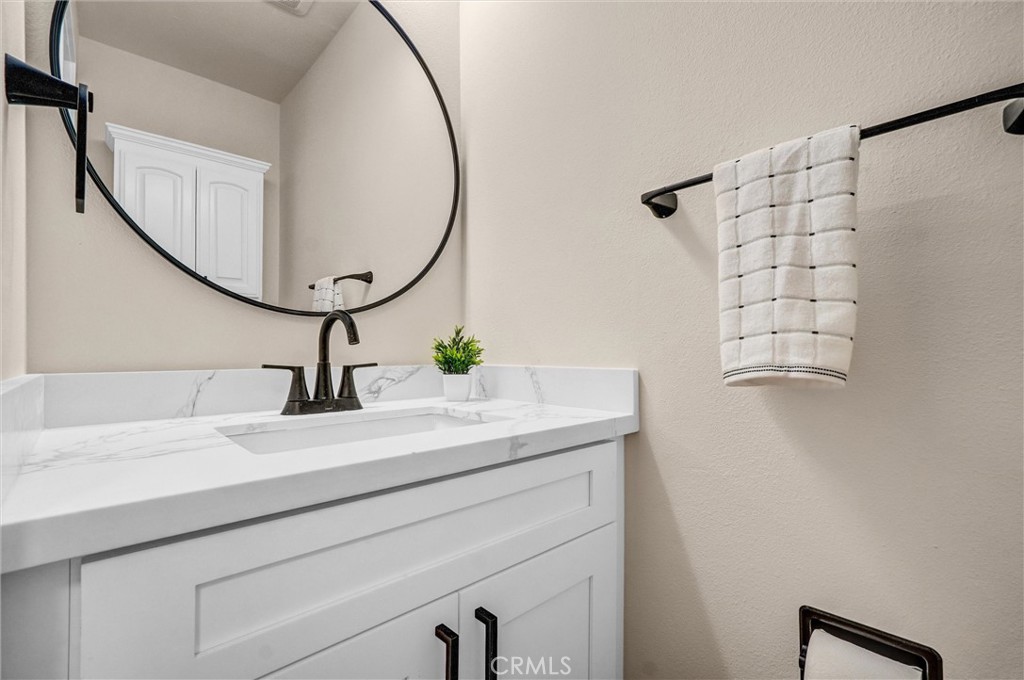1355 Limerick Drive Placentia, CA 92870 - Photo 15 of 33 a bathroom with a sink and a mirror