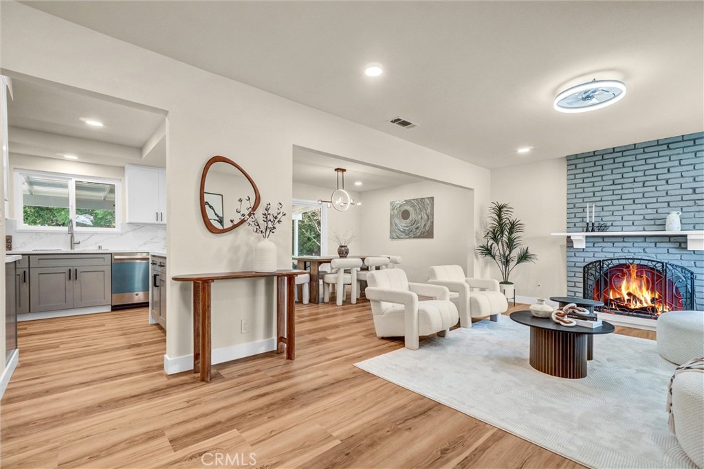 1355 Limerick Drive Placentia, CA 92870 - Photo 2 of 33 a living room with fireplace furniture and a wooden floor