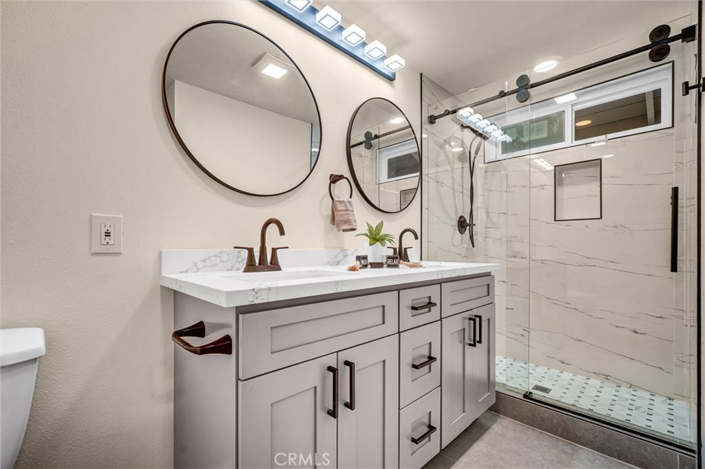 1355 Limerick Drive Placentia, CA 92870 - Photo 25 of 33 a bathroom with a sink and a mirror
