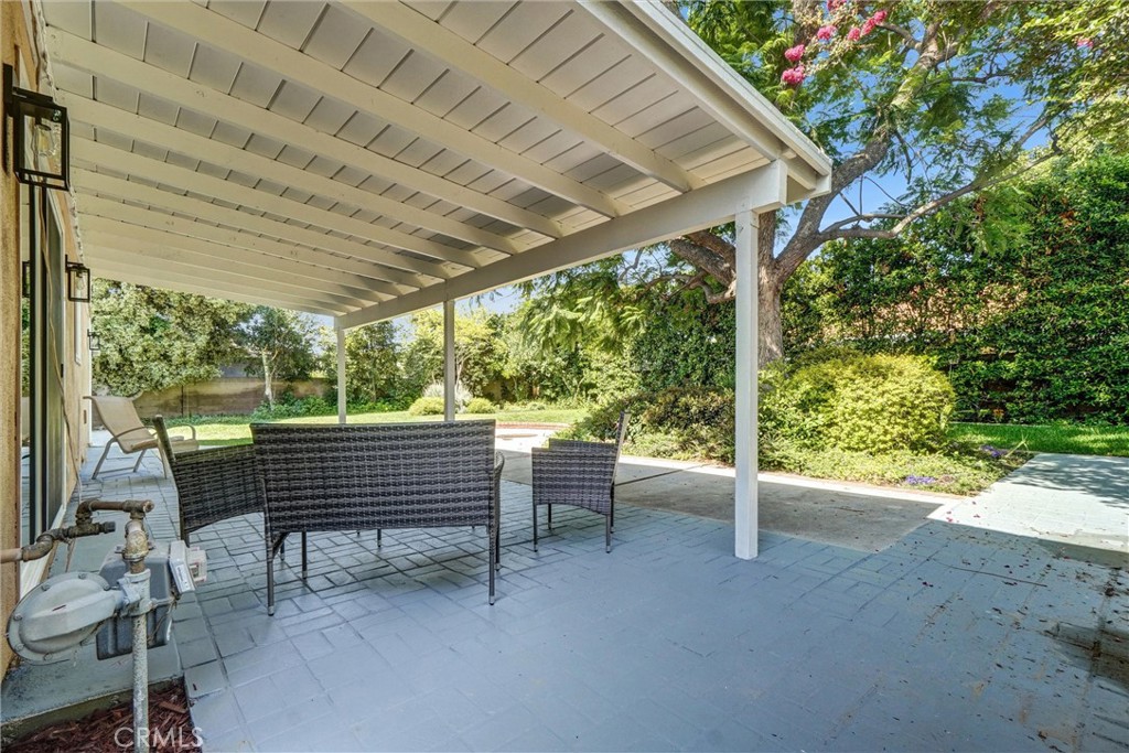 1355 Limerick Drive Placentia, CA 92870 - Photo 28 of 33 a view of a patio with a table chairs and a backyard