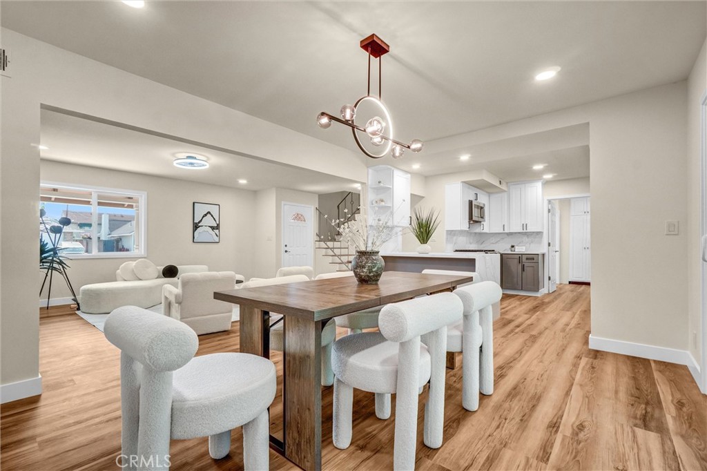 1355 Limerick Drive Placentia, CA 92870 - Photo 9 of 33 a view of a dining room and livingroom with furniture wooden floor a rug a chandelier