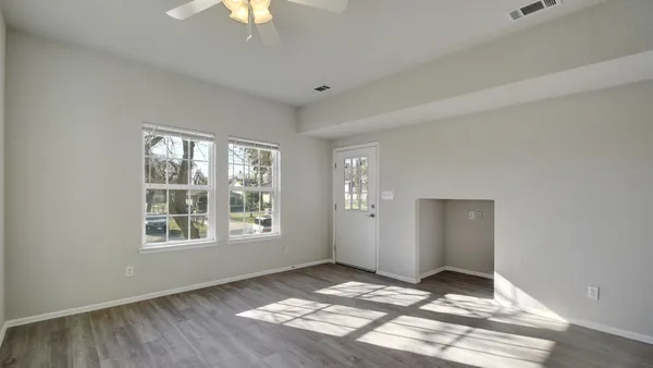 a view of an empty room and window