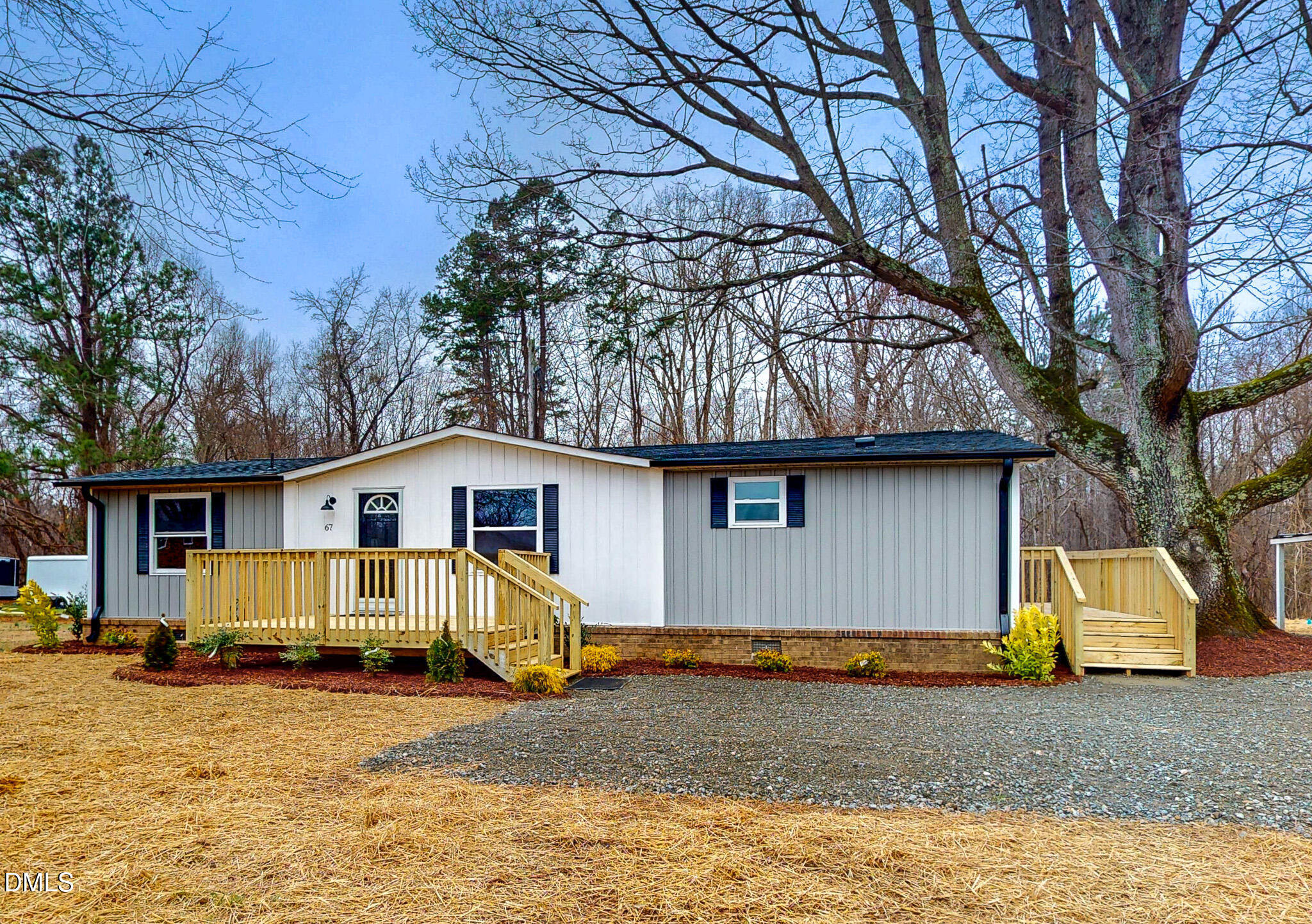 67 Halifax Road Roxboro, NC 27574 - Photo 25 of 48 a view of a house with a yard covered in snow