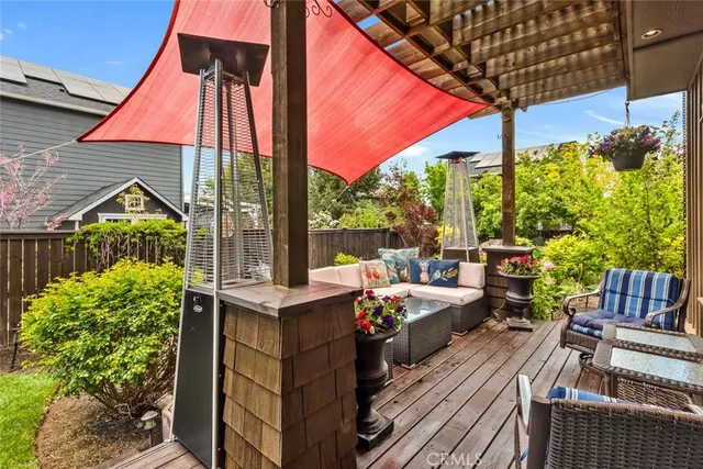a view of a chair and table in the backyard