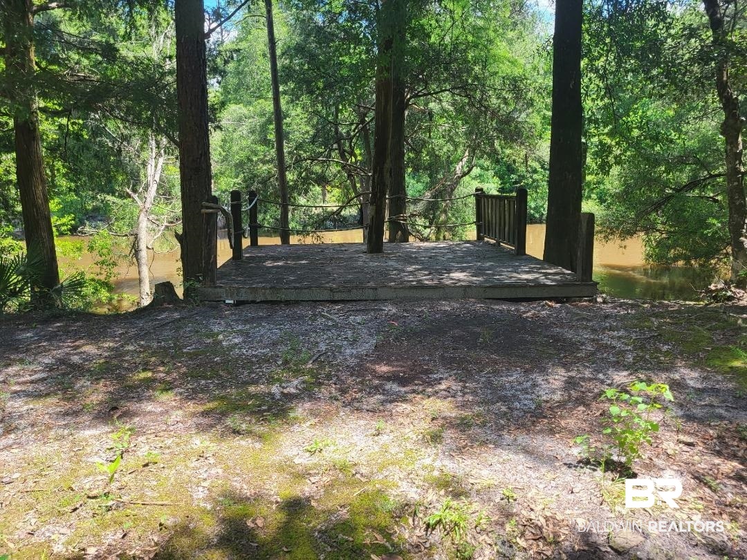 View of yard featuring a wooden deck