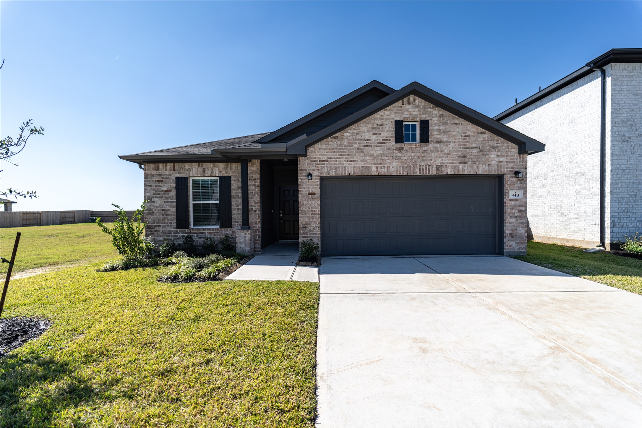 418 Hazy Meadows Drive Beasley, TX 77417 - Photo 2 of 17 a front view of a house with a yard