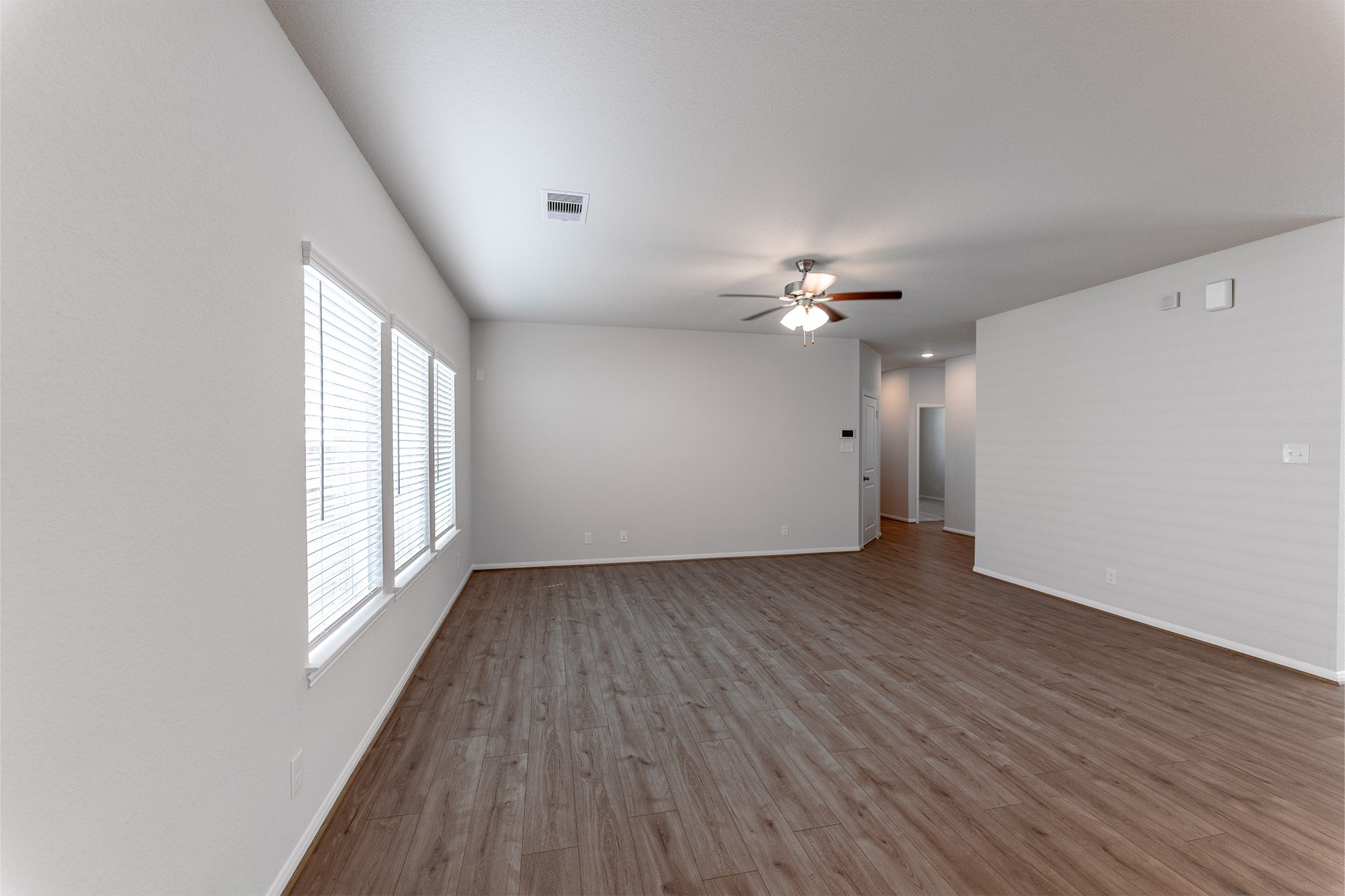 418 Hazy Meadows Drive Beasley, TX 77417 - Photo 7 of 17 a view of a livingroom with a ceiling fan and window