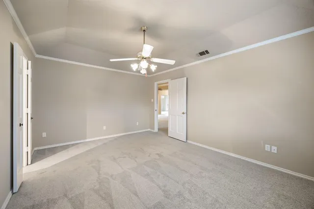 a spacious bathroom with a tub sink and mirror