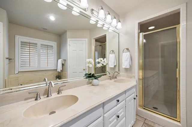 a bathroom with a bathtub and shower
