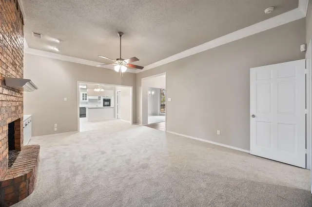 a view of a livingroom with furniture and a fireplace