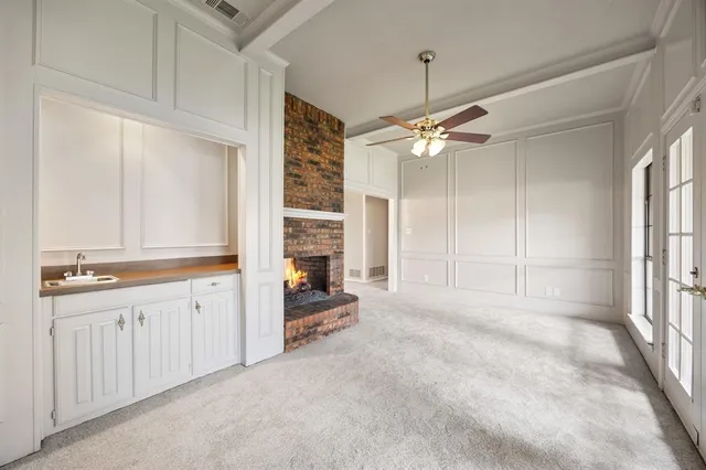 a view of a kitchen with a sink and cabinet area
