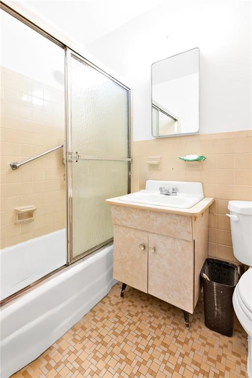 2940 West 5th Street, Unit 2B Brooklyn, NY 11224 - Photo 17 of 25 a bathroom with a sink toilet and shower