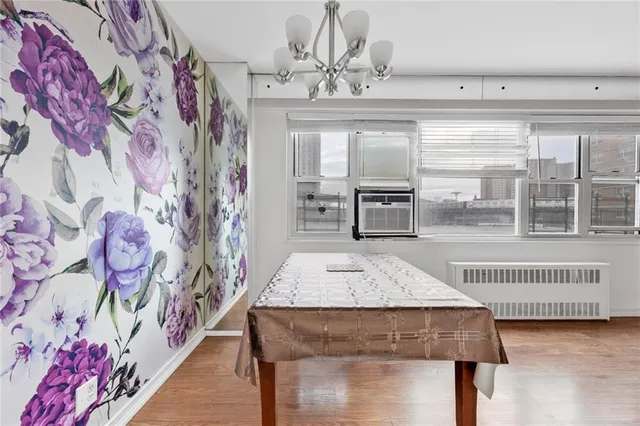 a living room with a table and chairs