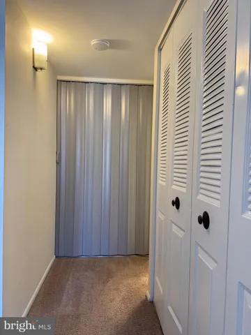 a view of a elevator and an entryway in a room
