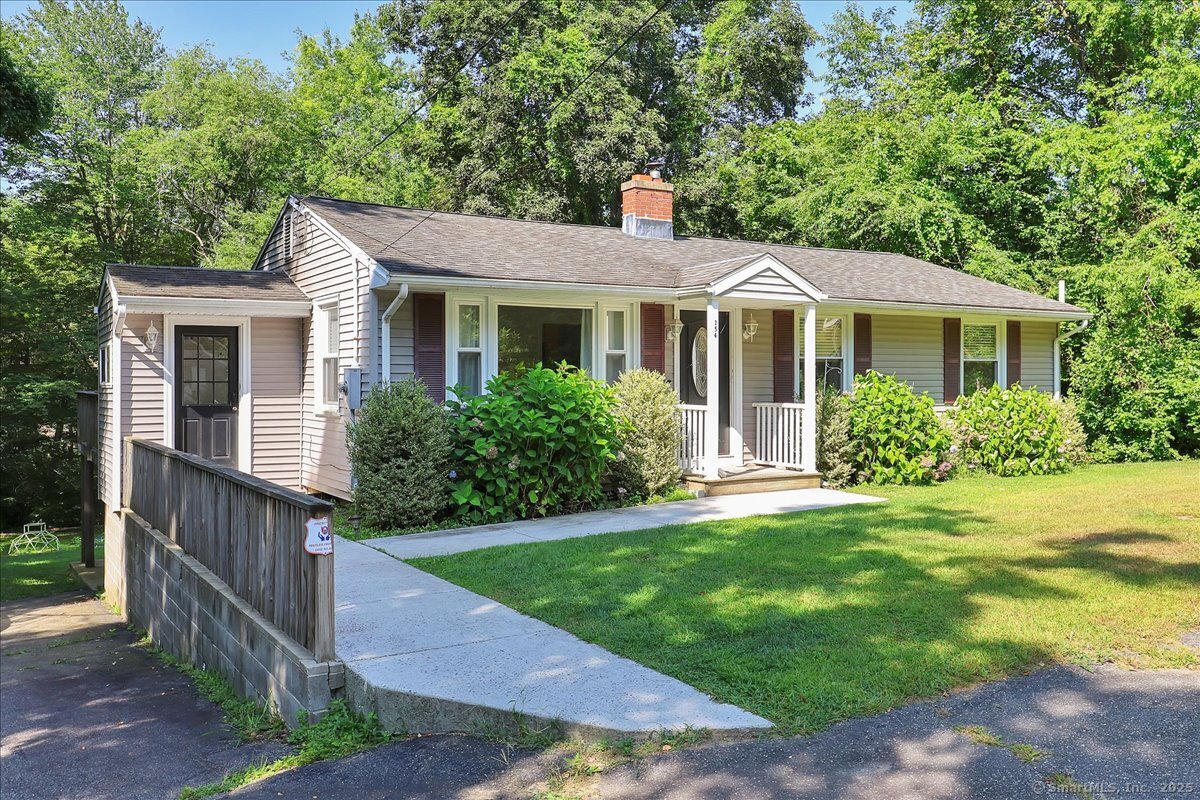 a view of a house with a yard