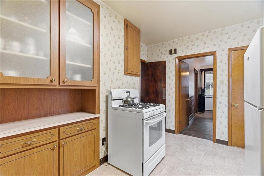 2375 East Beckert Avenue Pittsburgh, PA 15212 - Photo 14 of 28 a kitchen with a stove and a refrigerator