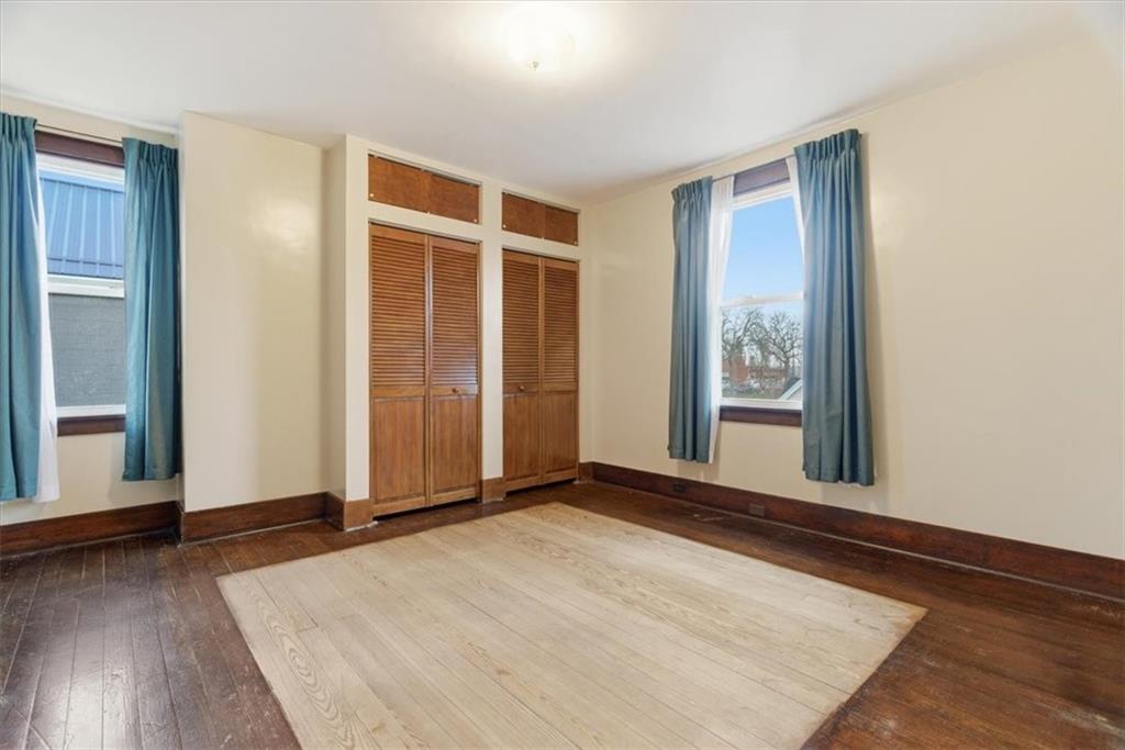 2375 East Beckert Avenue Pittsburgh, PA 15212 - Photo 20 of 28 an empty room with wooden floor and windows