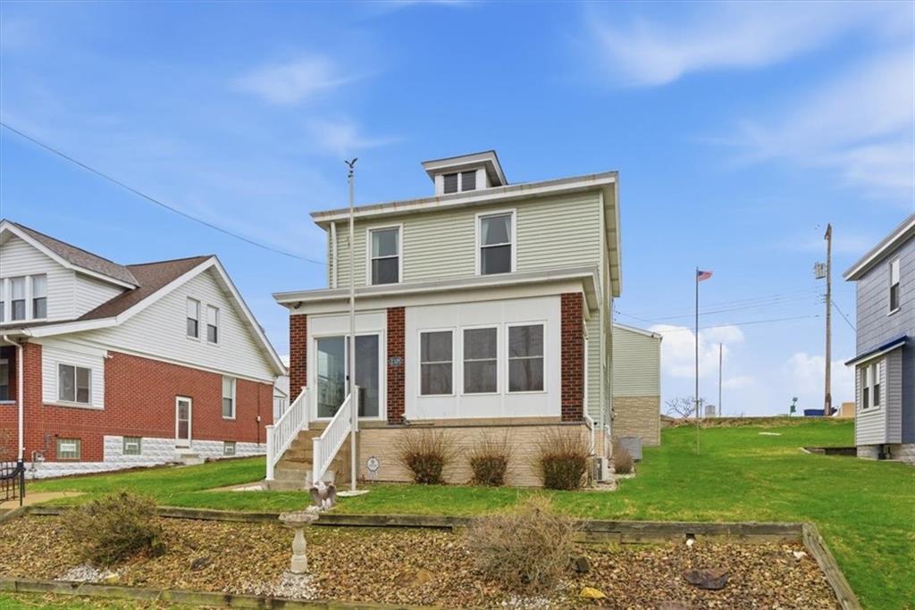 2375 East Beckert Avenue Pittsburgh, PA 15212 - Photo 2 of 28 a front view of a house with a yard
