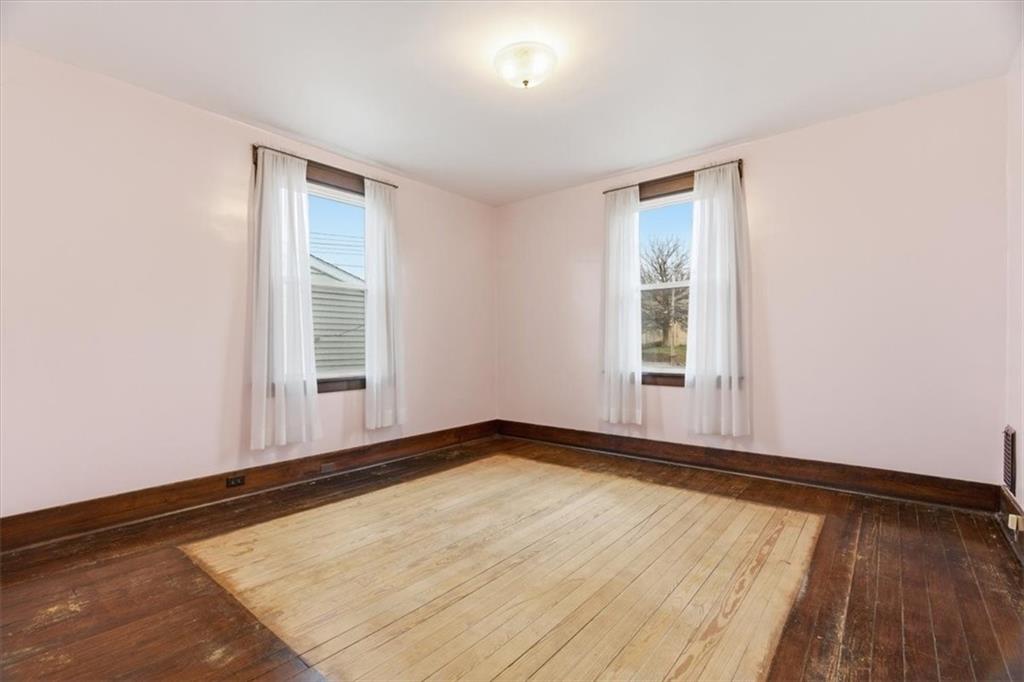 2375 East Beckert Avenue Pittsburgh, PA 15212 - Photo 22 of 28 an empty room with wooden floor and windows
