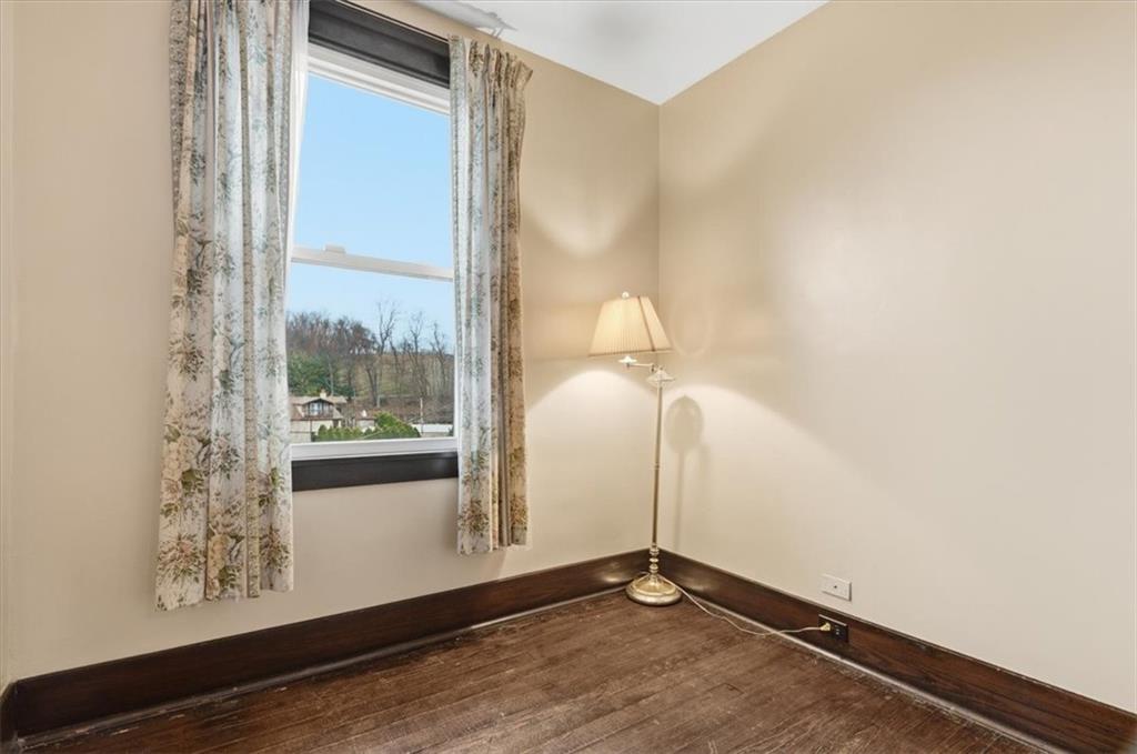 2375 East Beckert Avenue Pittsburgh, PA 15212 - Photo 23 of 28 a view of an empty room with wooden floor and a window