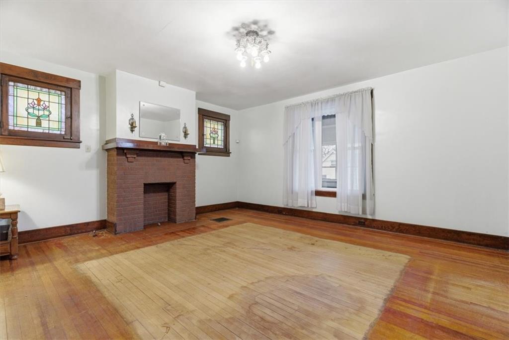 2375 East Beckert Avenue Pittsburgh, PA 15212 - Photo 7 of 28 a view of an empty room with a fireplace and a window