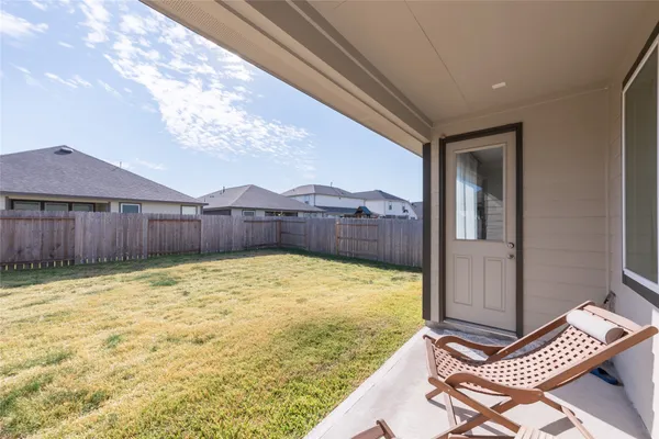 a view of swimming pool with a backyard